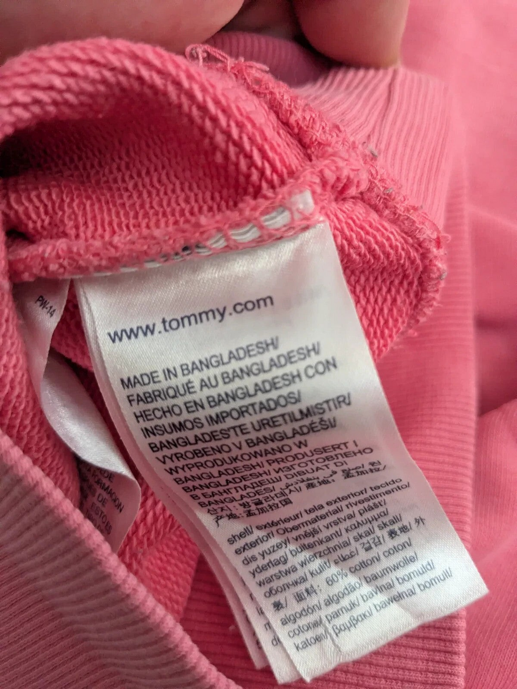 My Store Tommy Jeans pink cotton sweatshirt care label showing material composition and origin