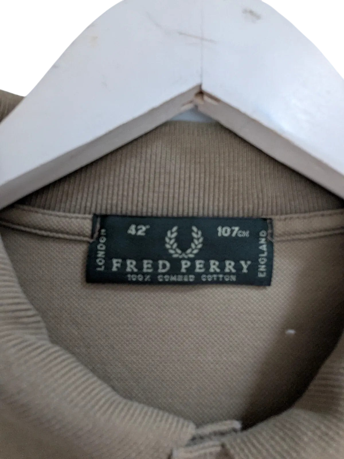 My Store Fred Perry khaki cotton pique polo shirt interior neck label with size 42 and laurel wreath logo