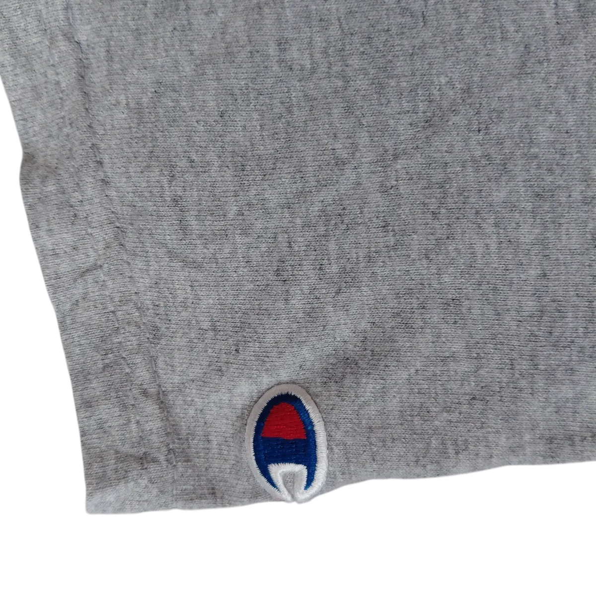 My Store grey heather cotton Champion t-shirt sleeve with embroidered red, white, and blue logo patch
