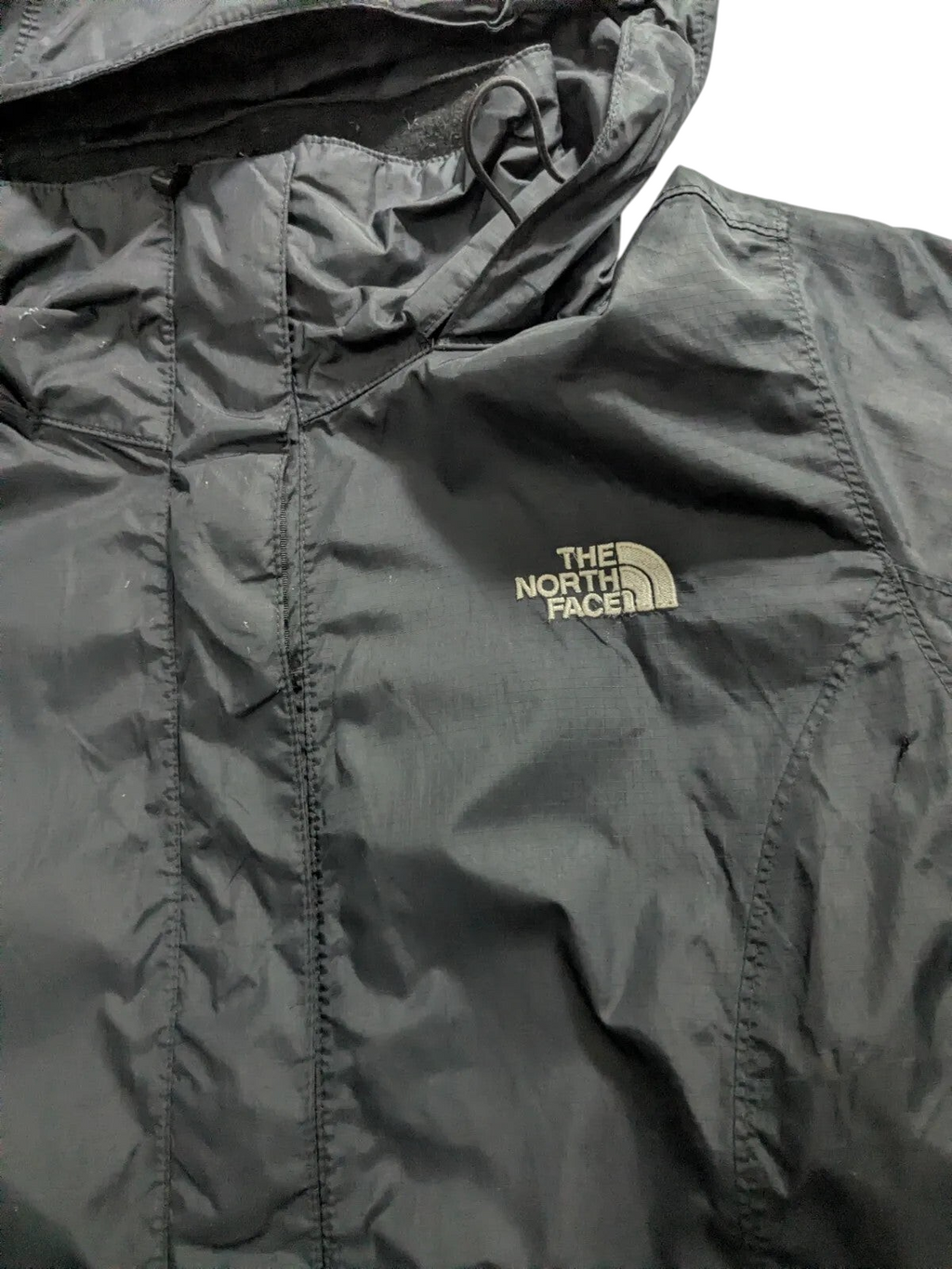 My Store The North Face black waterproof nylon ripstop shell jacket with hood and front zip closure