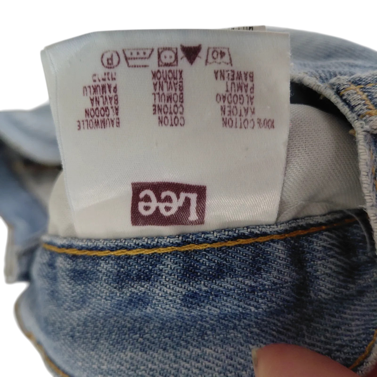 My Store Lee denim shorts care label showing 100 percent cotton material composition