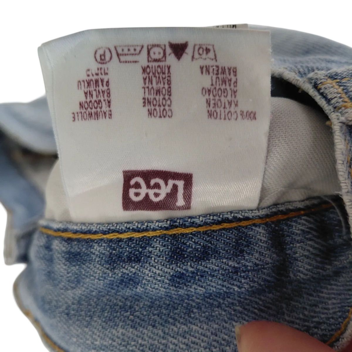 My Store Lee denim shorts care label showing 100 percent cotton material composition