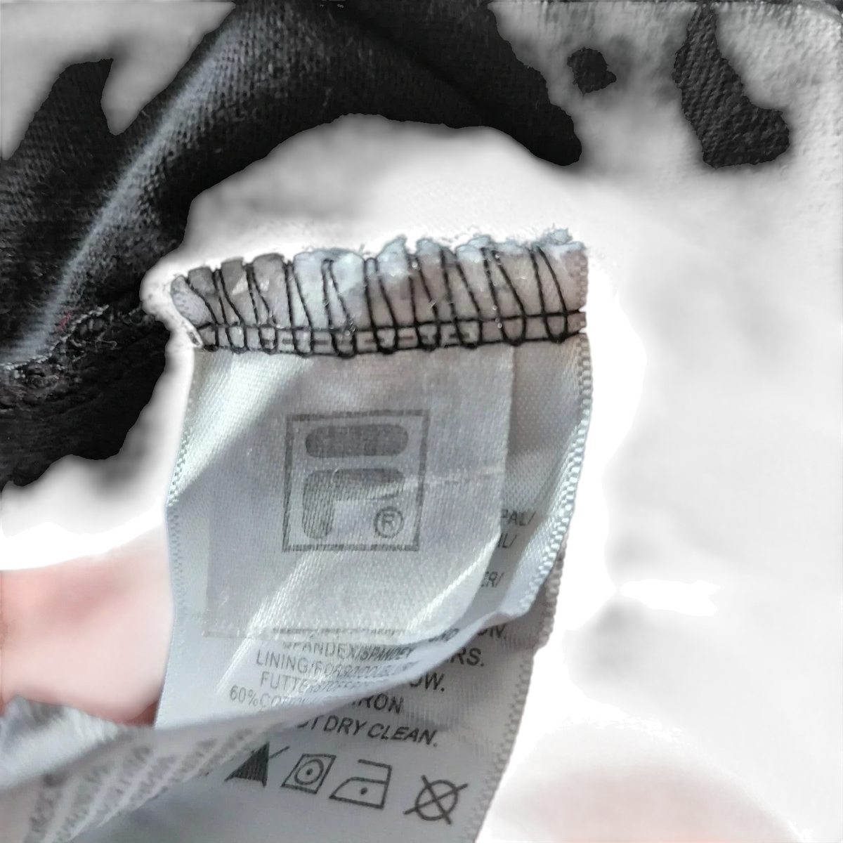 My Store pre-owned FILA crew neck t-shirt care label showing fabric composition and branding