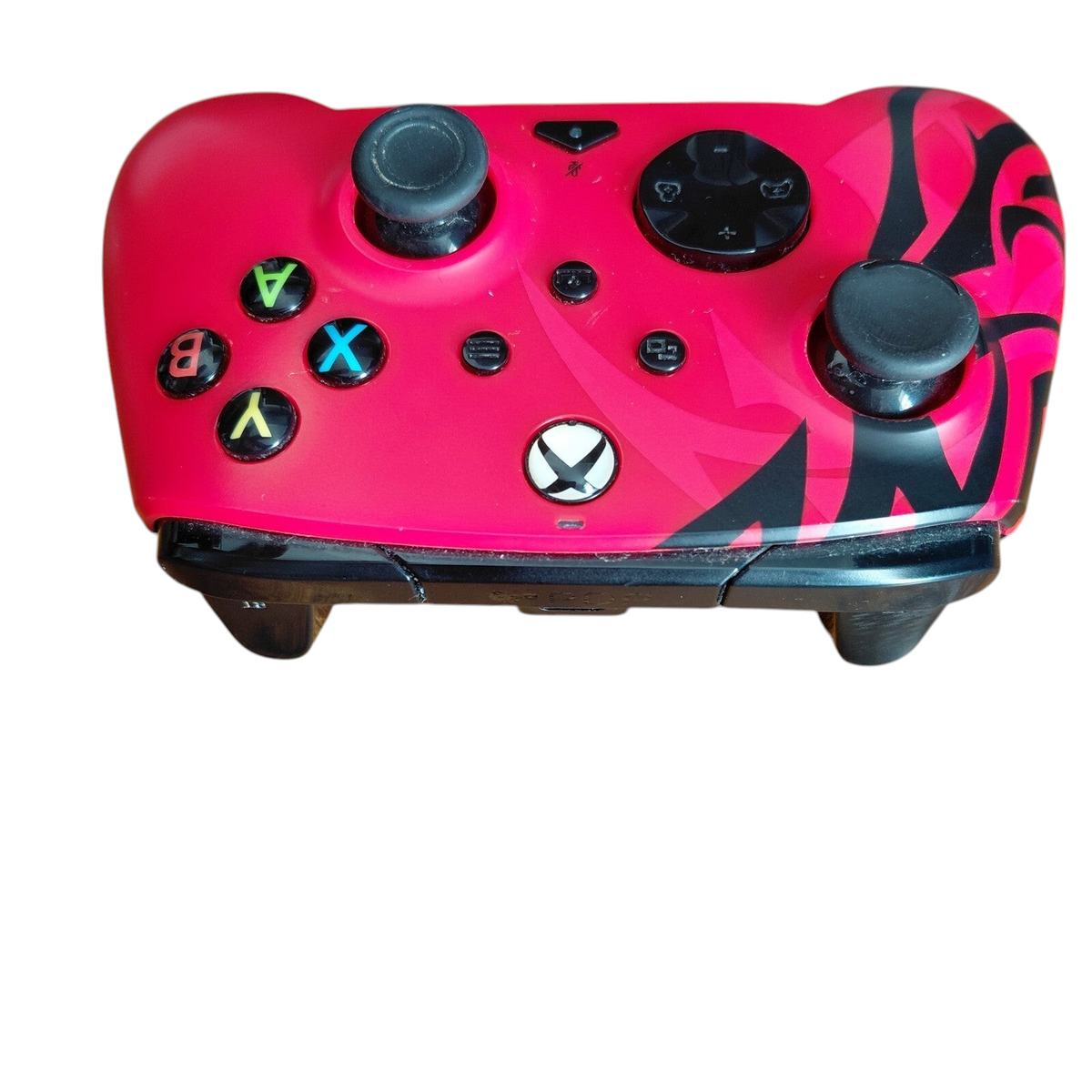 My Store PDP Xbox REMATCH Advanced Wired Controller in Spirit Red with black tribal accents on a wooden surface
