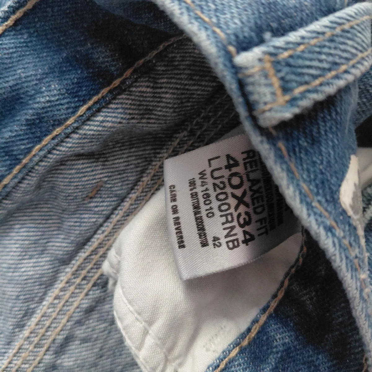 My Store Dickies carpenter jeans interior care label showing size 40x34 and 100 percent cotton material