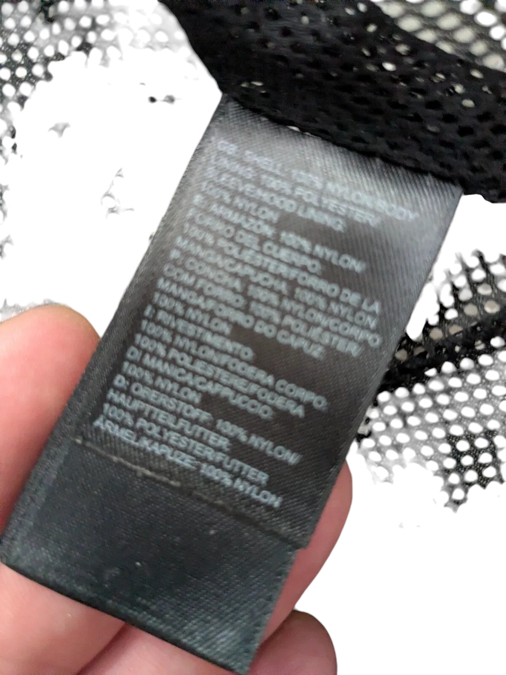 My Store The North Face black nylon ripstop jacket care label showing material composition details