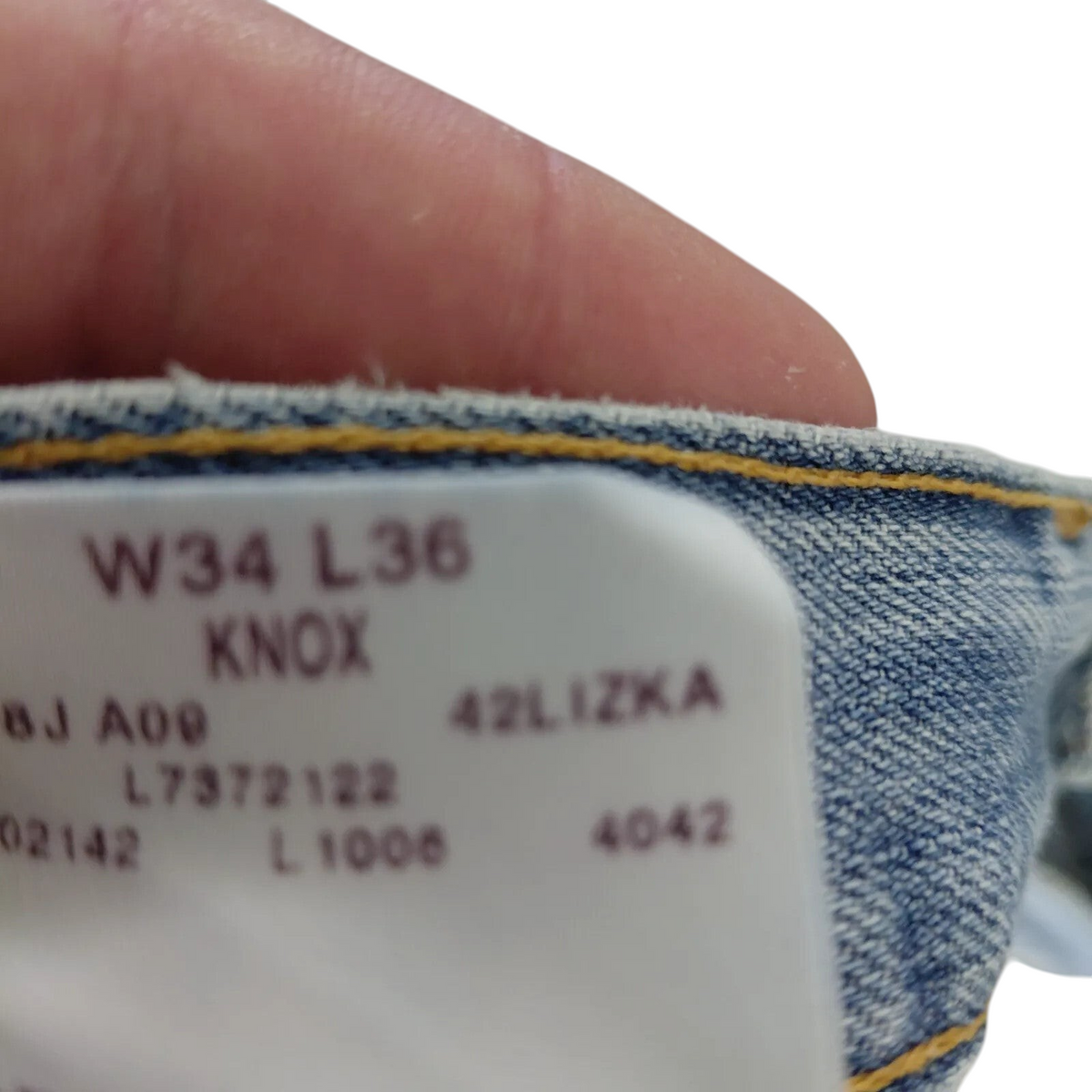 My Store Lee jeans interior size tag showing W34 L36 and Knox model details on light blue denim fabric