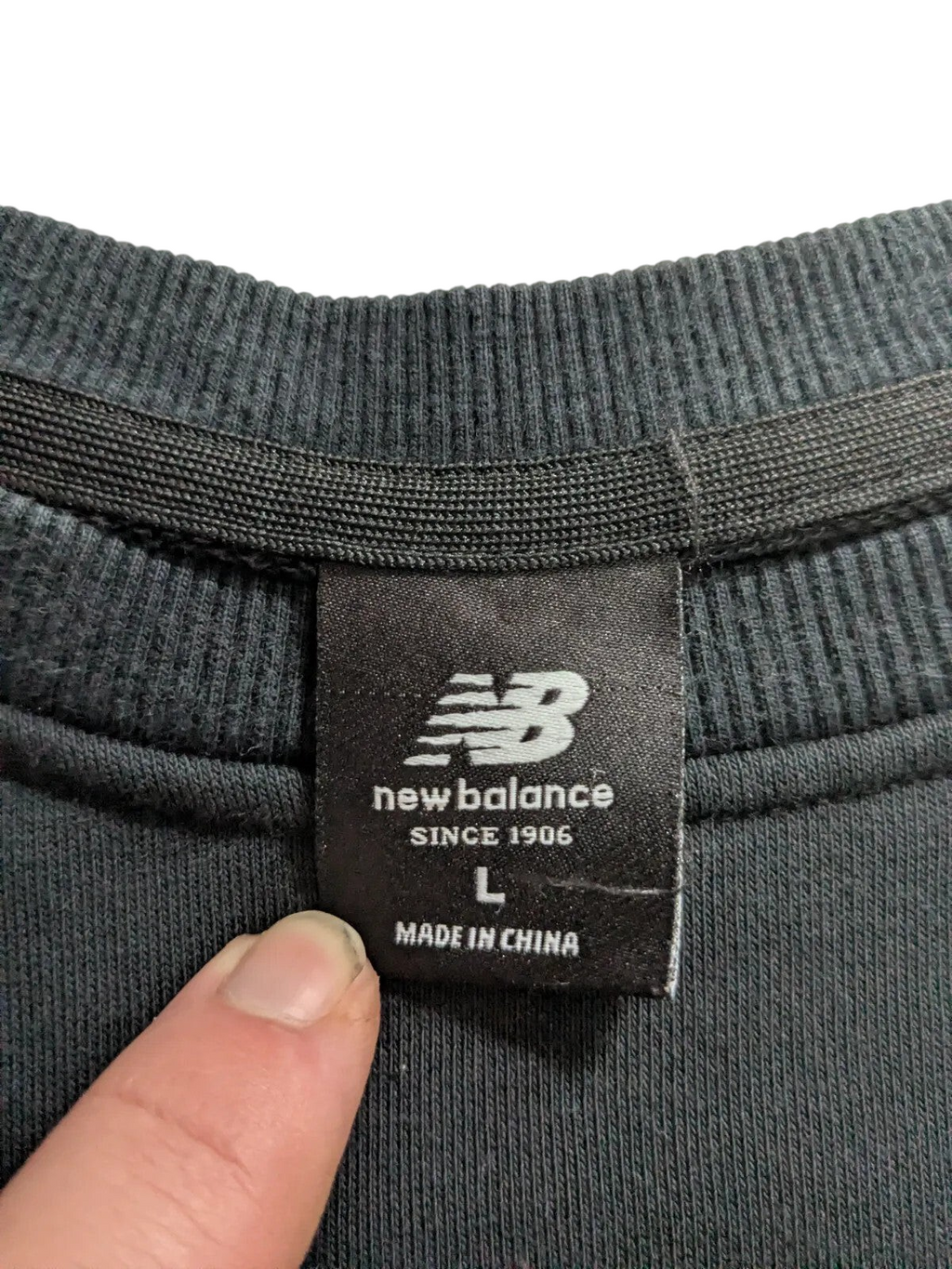 My Store New Balance black crewneck sweatshirt size L interior brand label and ribbed collar detail