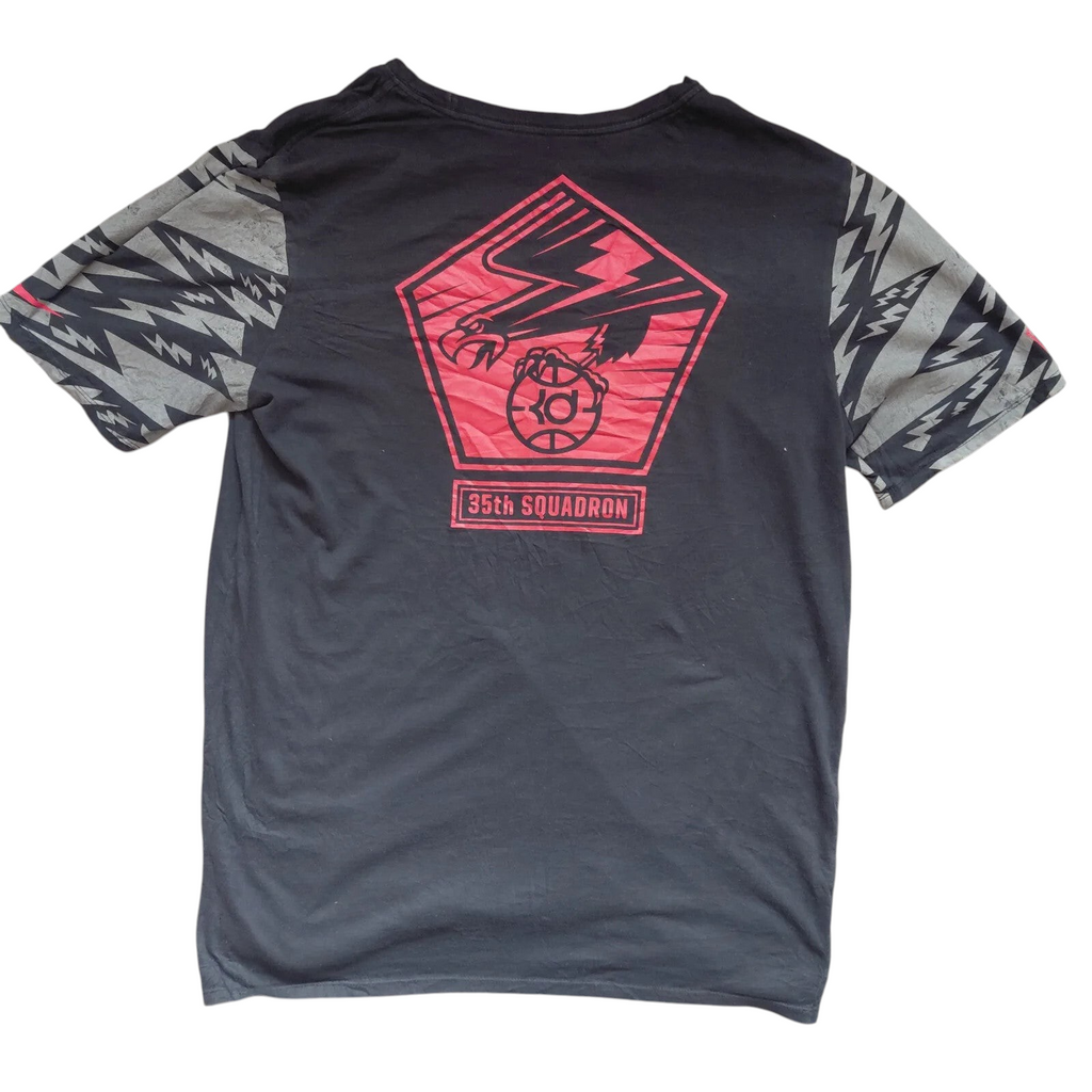 My Store Nike The Nike Tee black cotton t-shirt with 35th Squadron eagle graphic and patterned grey sleeves