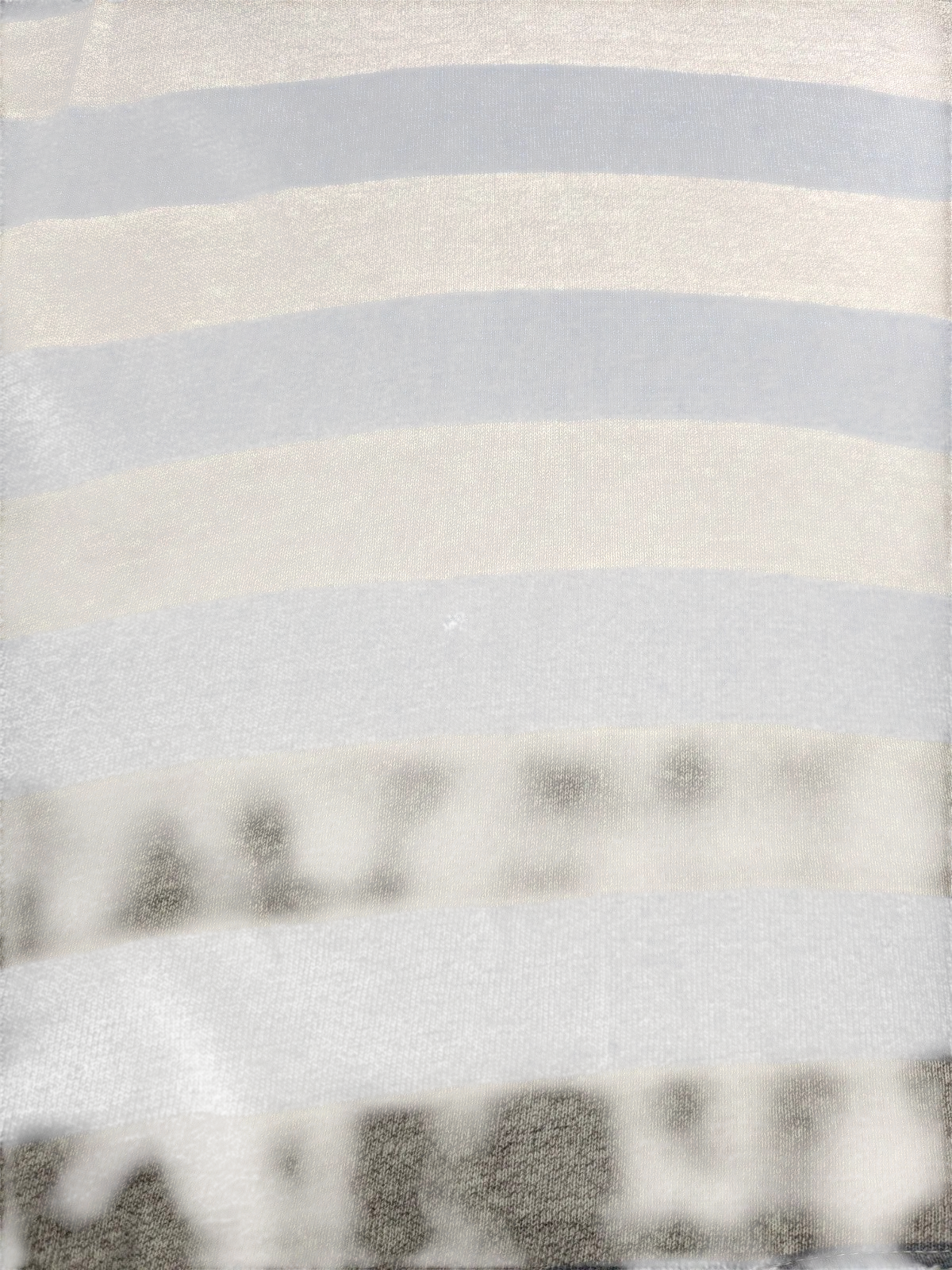 My Store grey and white striped fabric detail from a Converse long sleeve polo shirt