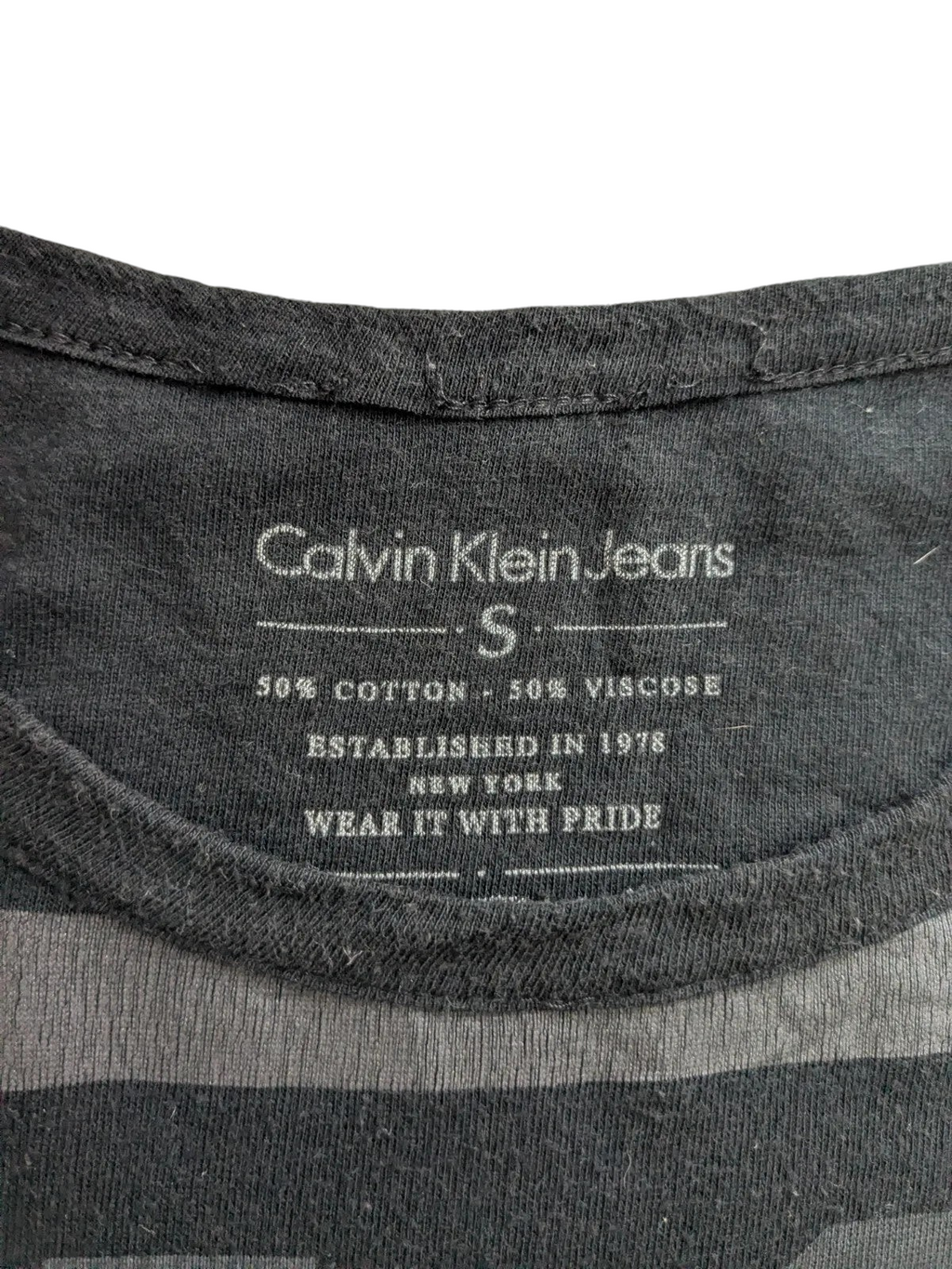 My Store Calvin Klein Jeans black crew neck t-shirt inner label showing size small and cotton viscose fabric blend