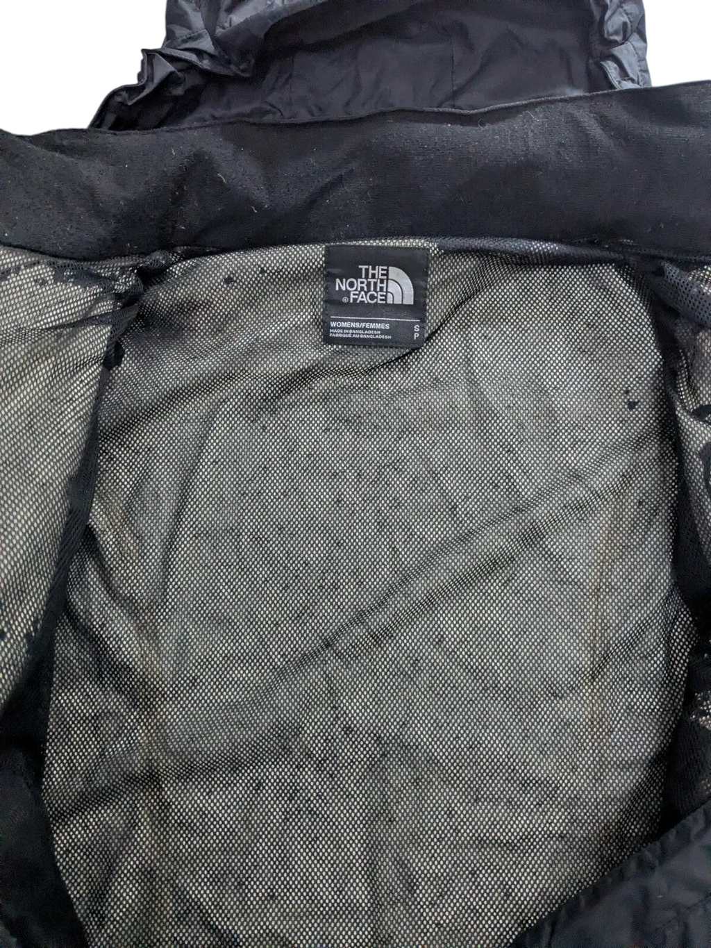 My Store The North Face womens black waterproof shell jacket interior showing mesh lining and size small brand label