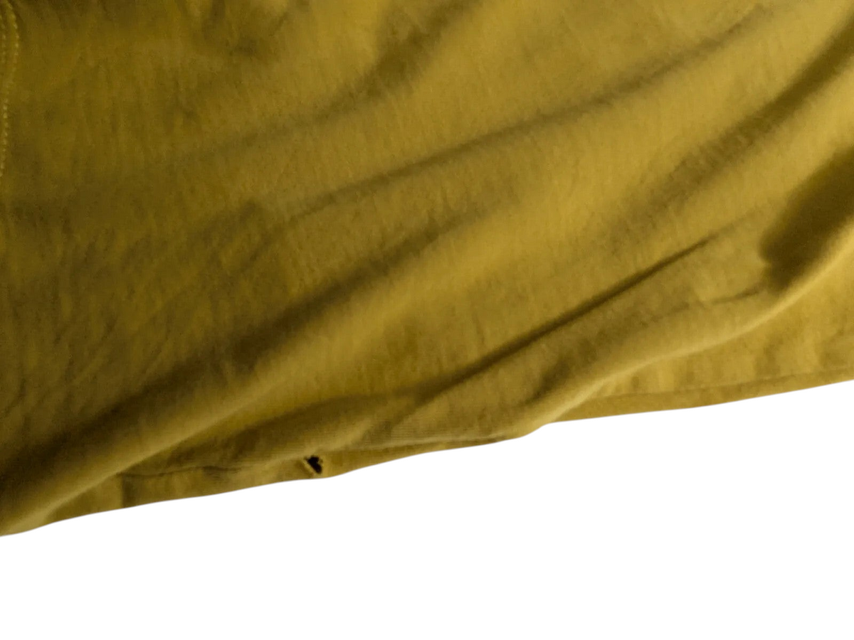 My Store Timberland yellow cotton t-shirt showing a small fabric tear near the hemline