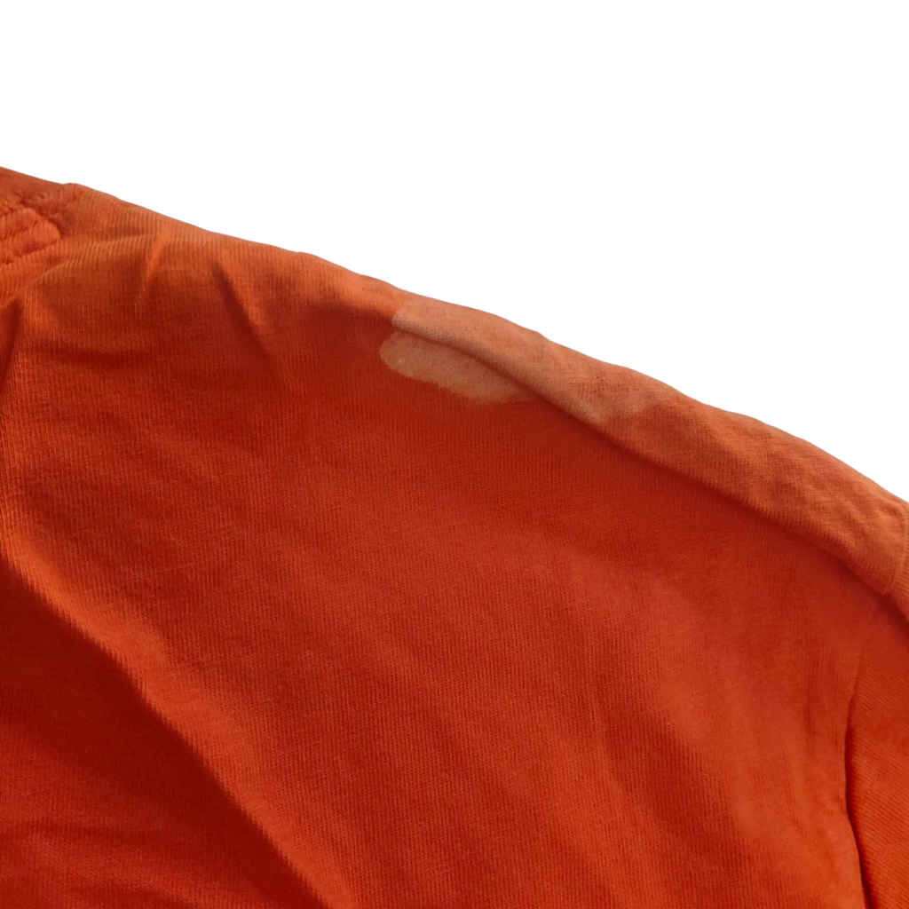 My Store Timberland orange organic cotton t-shirt showing a light stain on the shoulder seam