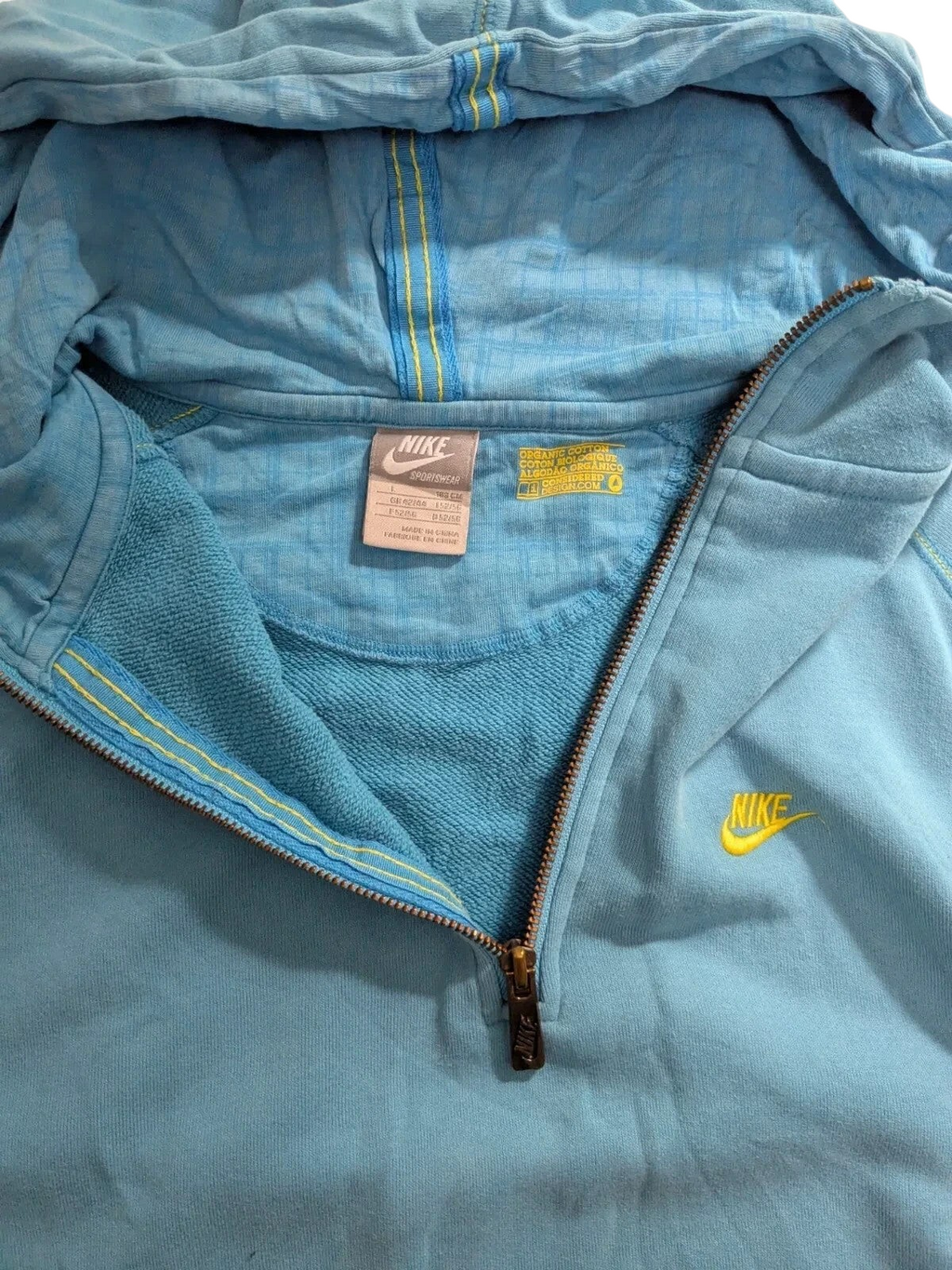 My Store Nike blue cotton quarter zip hoodie with yellow logo and drawstring hood, size large.
