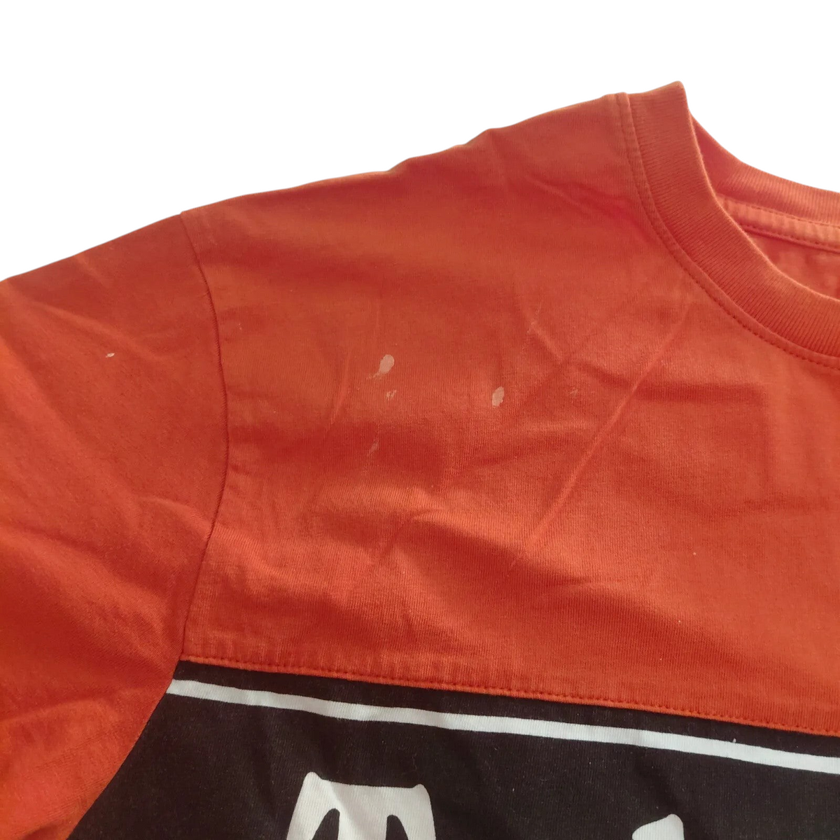 My Store Timberland orange and black organic cotton t-shirt showing small white marks on the shoulder area