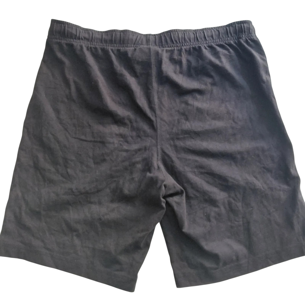 My Store black Champion athletic shorts featuring an elastic waistband, back view.