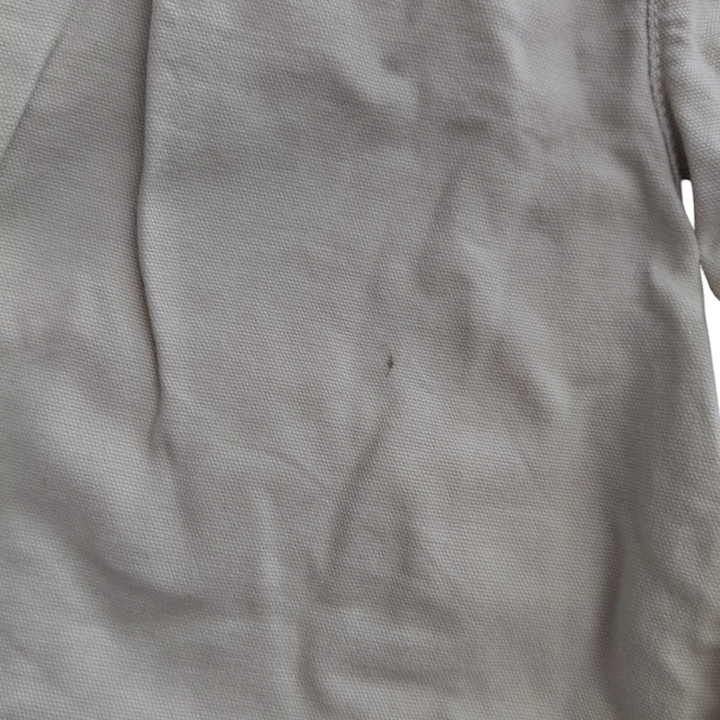 My Store beige Columbia cotton cargo shorts featuring a small dark spot on the fabric surface