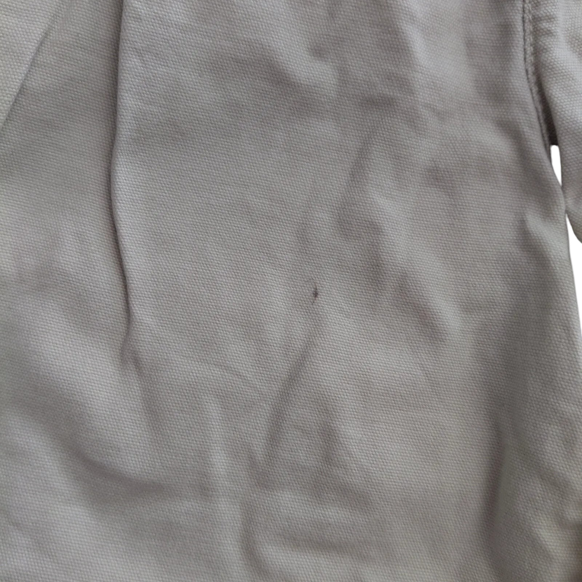 My Store beige Columbia cotton cargo shorts featuring a small dark spot on the fabric surface