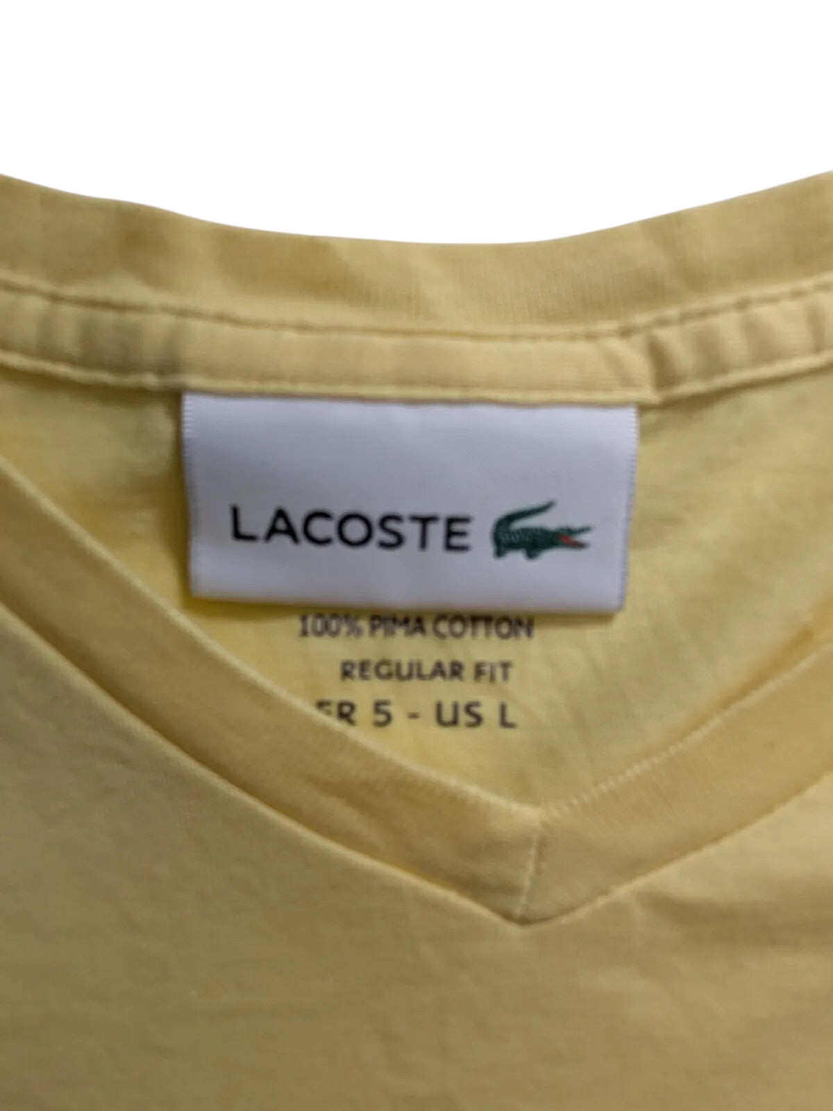 My Store Lacoste yellow V-neck t-shirt label showing 100% pima cotton regular fit size FR 5 US L