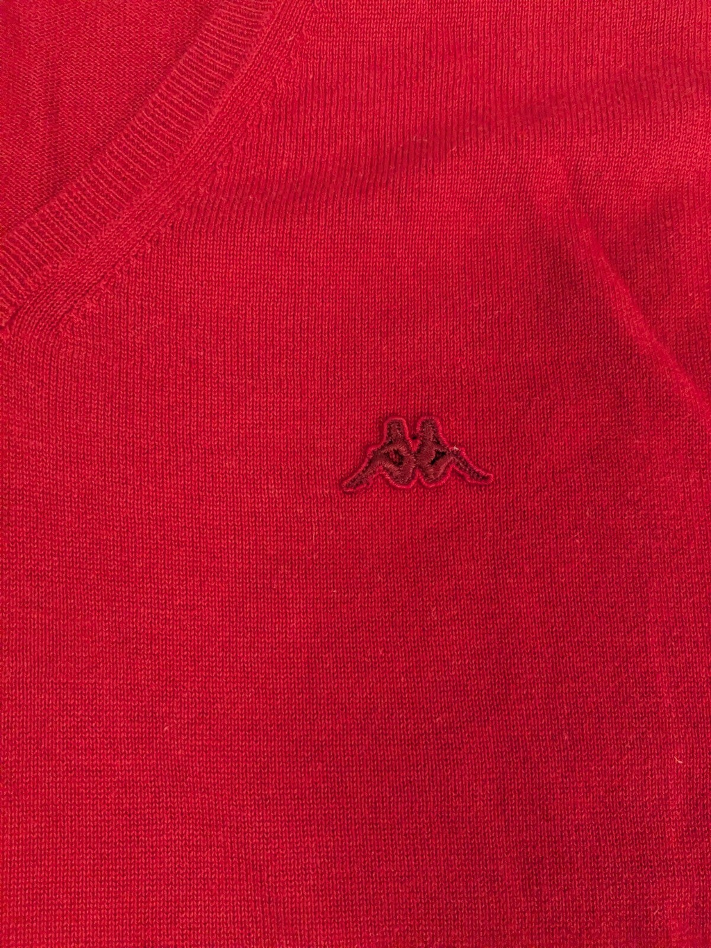 My Store Kappa red V-neck sweater with a subtle embroidered logo on the chest and soft knit texture