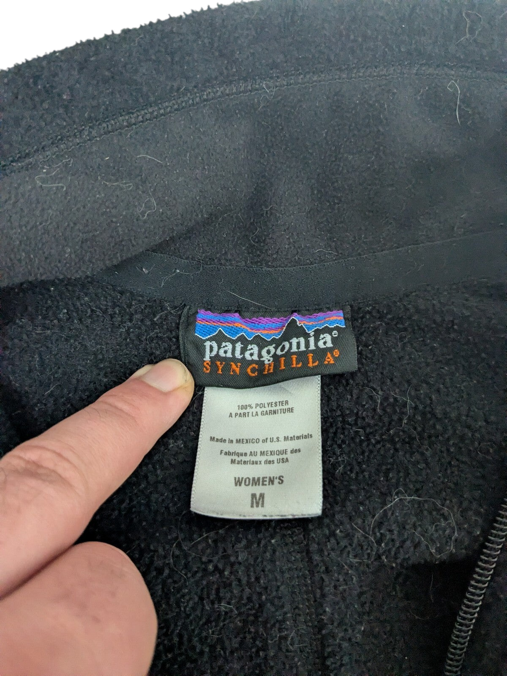 My Store Patagonia Synchilla black fleece pullover size medium tag detail