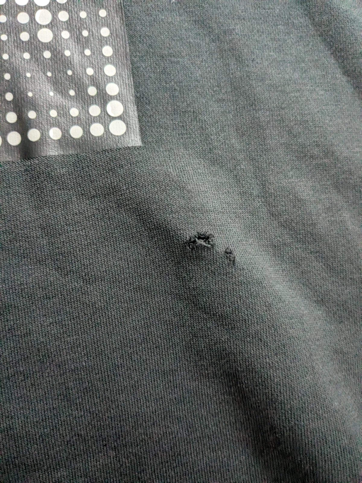 My Store pre-owned black New Balance crewneck sweatshirt showing a small fabric nick on the front