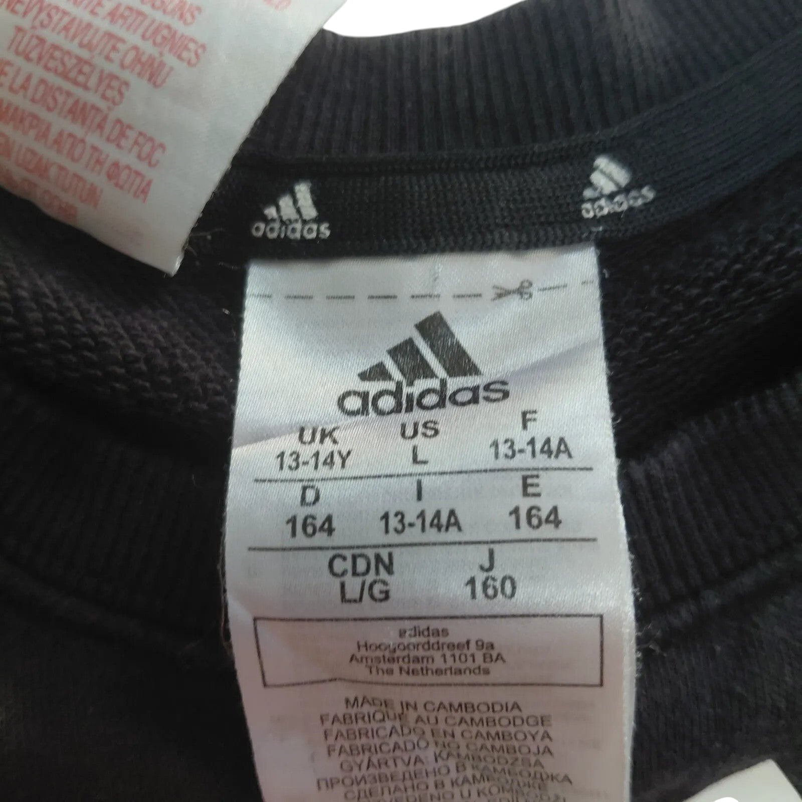 My Store Adidas black cotton blend crewneck sweatshirt size label showing UK 13-14Y sizing details