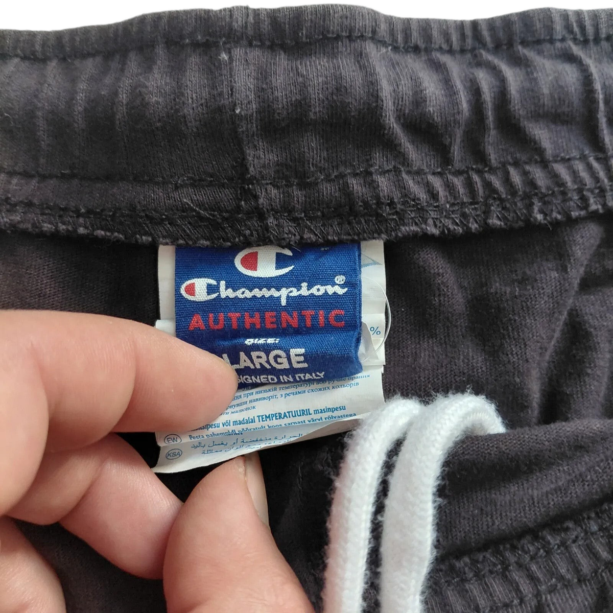 My Store Champion black athletic shorts featuring an elastic waistband with white drawstring and size large label