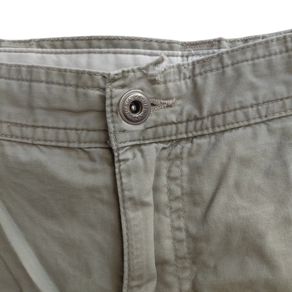 My Store beige Columbia cargo shorts featuring a branded metal button closure and durable cotton fabric.