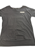 My Store pre-owned black Champion t-shirt with a small logo patch on the chest and a high-low hemline