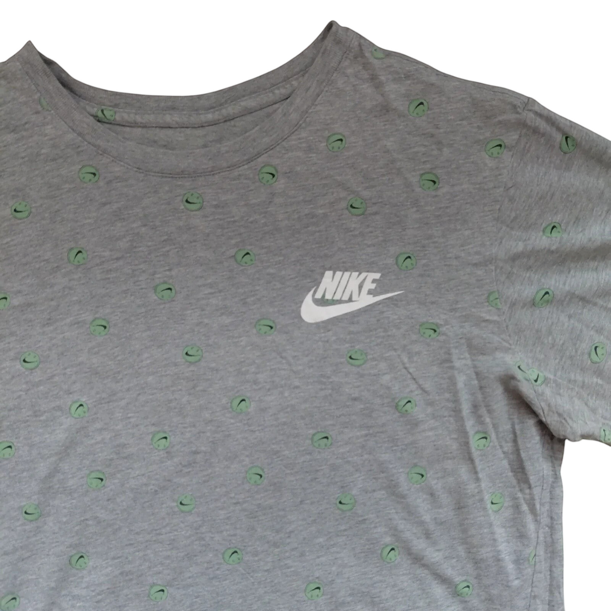 My Store grey Nike crew neck t-shirt featuring a white logo and small green smiley face graphic print