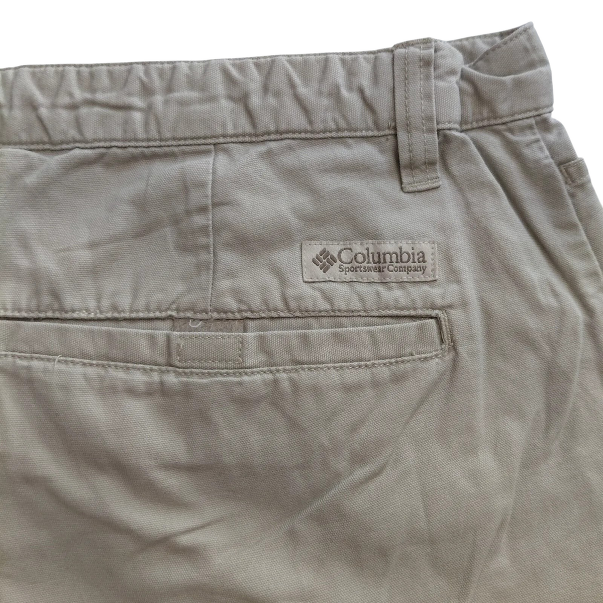 My Store beige Columbia cotton cargo shorts featuring a rear pocket with the brand logo patch.