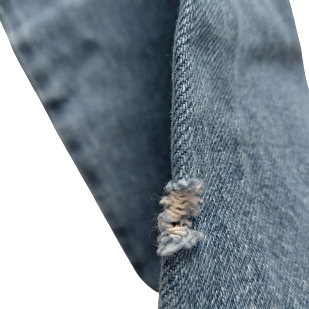 My Store Dickies carpenter jeans in mid blue denim showing a close-up of distressed fabric detail