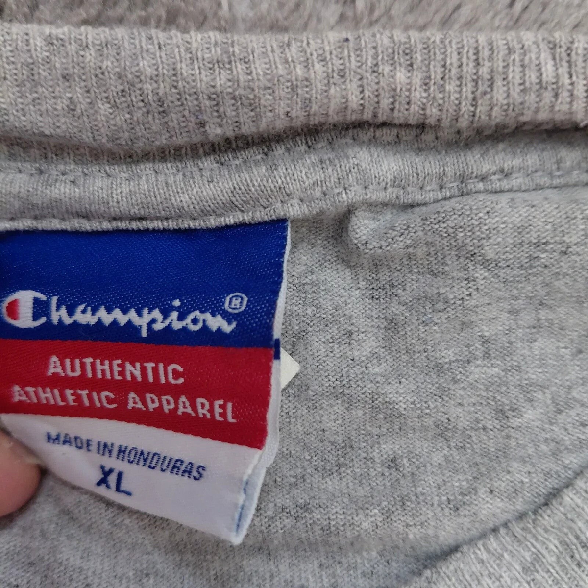 My Store Champion grey heather cotton t-shirt neck label showing size XL and authentic athletic apparel branding
