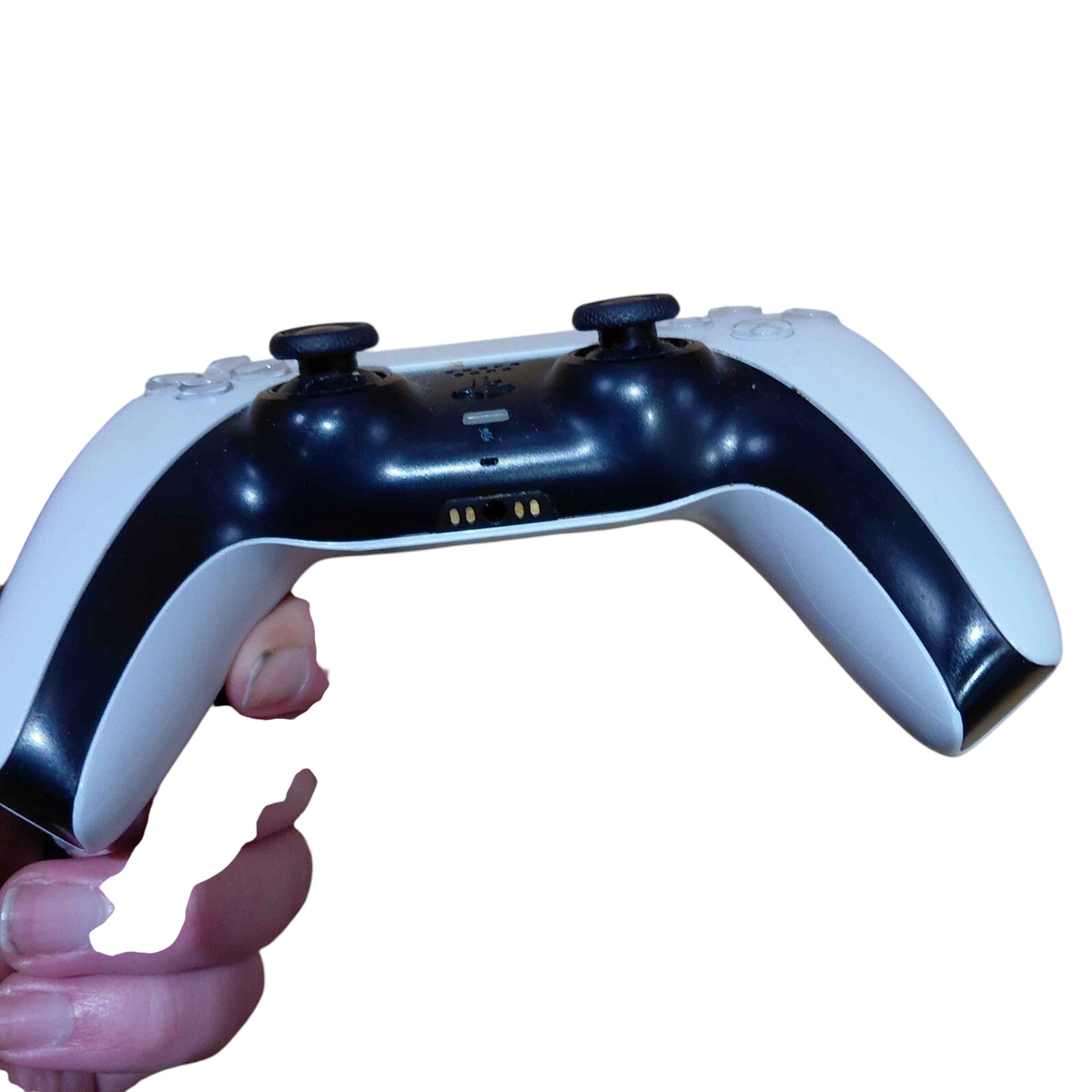 My Store white and black Sony DualSense wireless controller for PS5 held in hand, showing charging port and buttons.