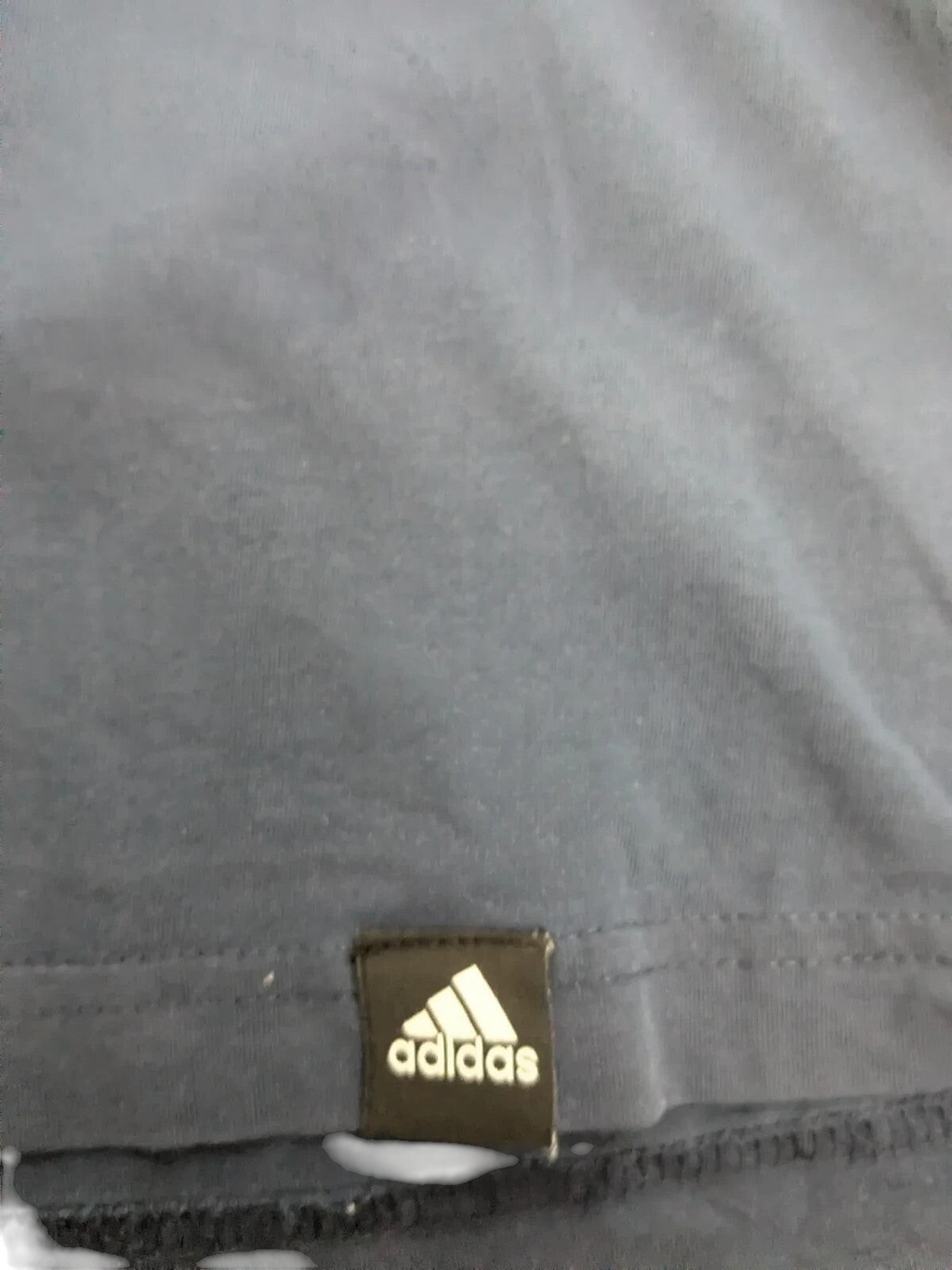 My Store navy cotton Adidas t-shirt featuring a small black and white logo patch at the hem