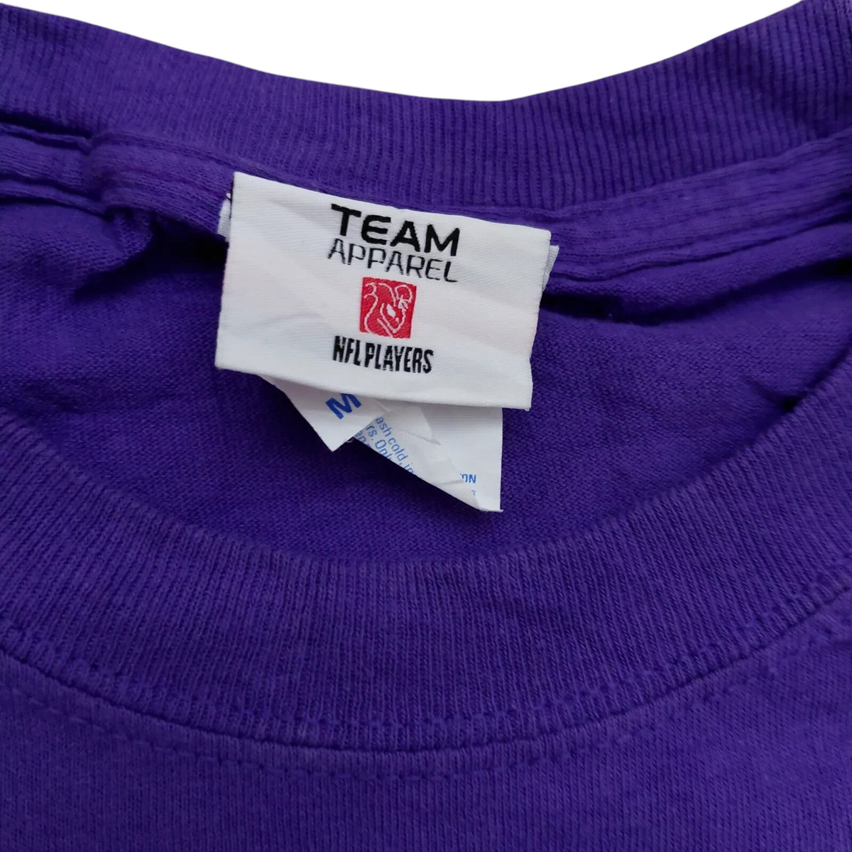 My Store Team Apparel purple Vikings NFL football t-shirt neck label showing size medium and NFL Players logo