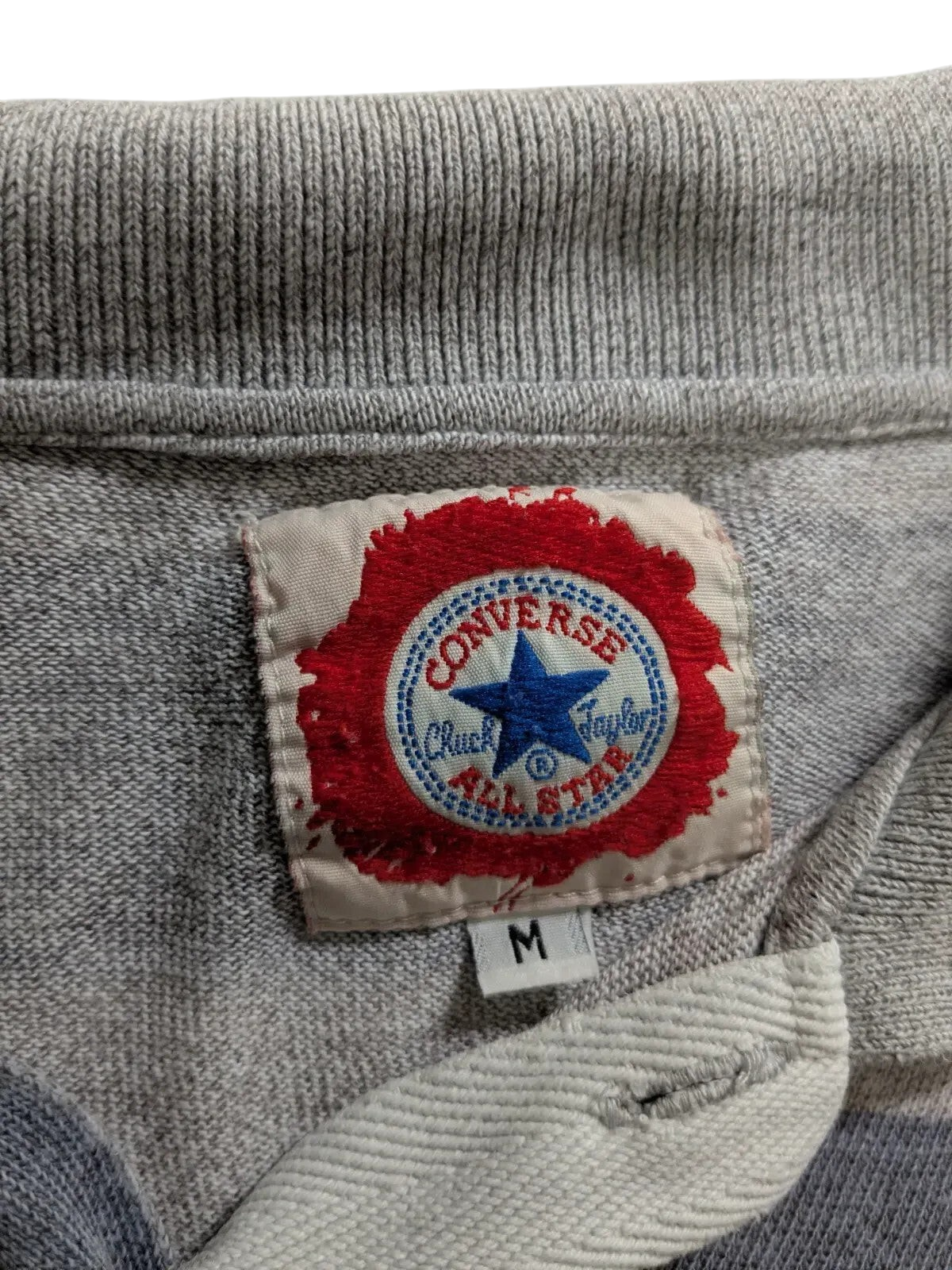 My Store Converse grey polo shirt featuring a red and blue embroidered Chuck Taylor All Star logo tag in size medium