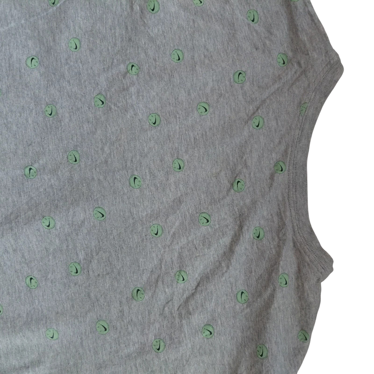 My Store Nike grey cotton t-shirt featuring a repeating light green smiley face and swoosh logo graphic print