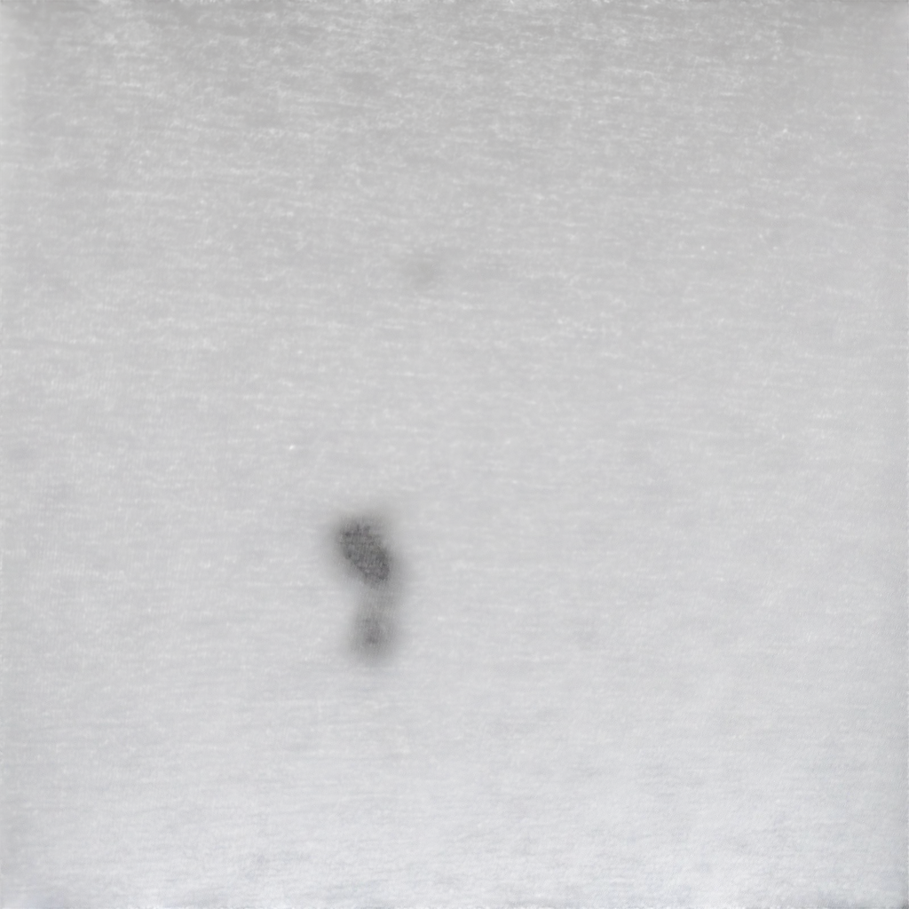 Close up of grey polyester fabric on a My Store Under Armour performance t-shirt showing a small stain