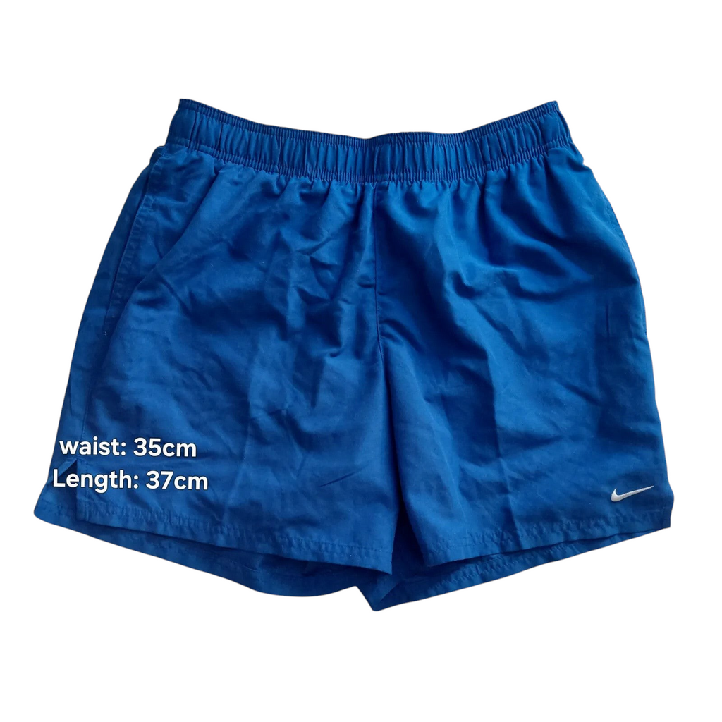 My Store blue Nike athletic shorts with elastic drawstring waist, mesh lining, and small white logo on the hem.