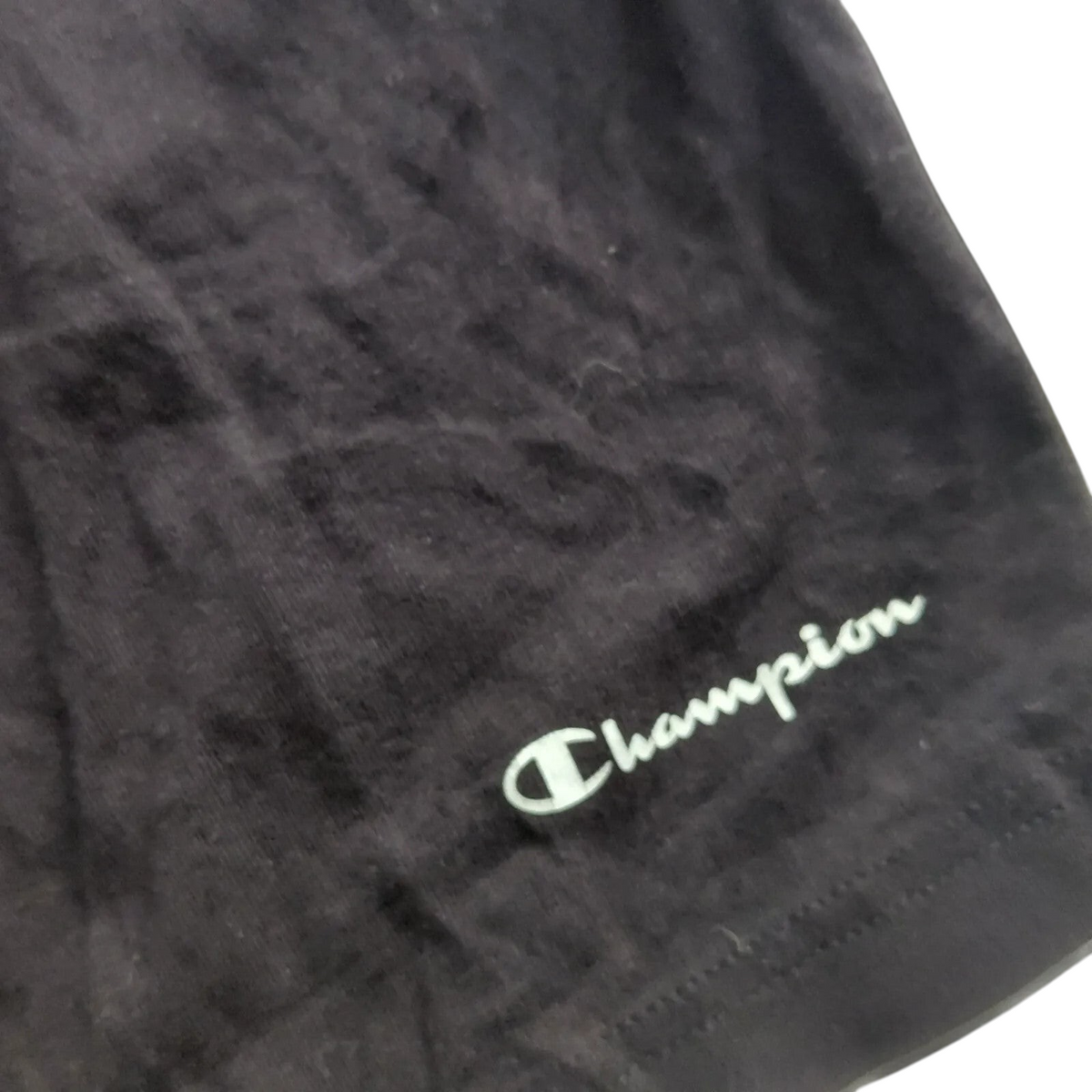 My Store black Champion athletic shorts featuring a white embroidered logo detail on the fabric.