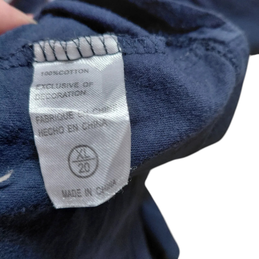 My Store navy blue Nike cotton t-shirt care label showing size XL and country of origin